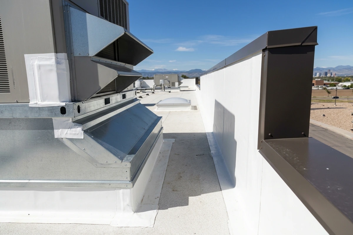 Multi-tier commercial HVAC curb flashings and parapet wall detail on a Colorado Springs roof